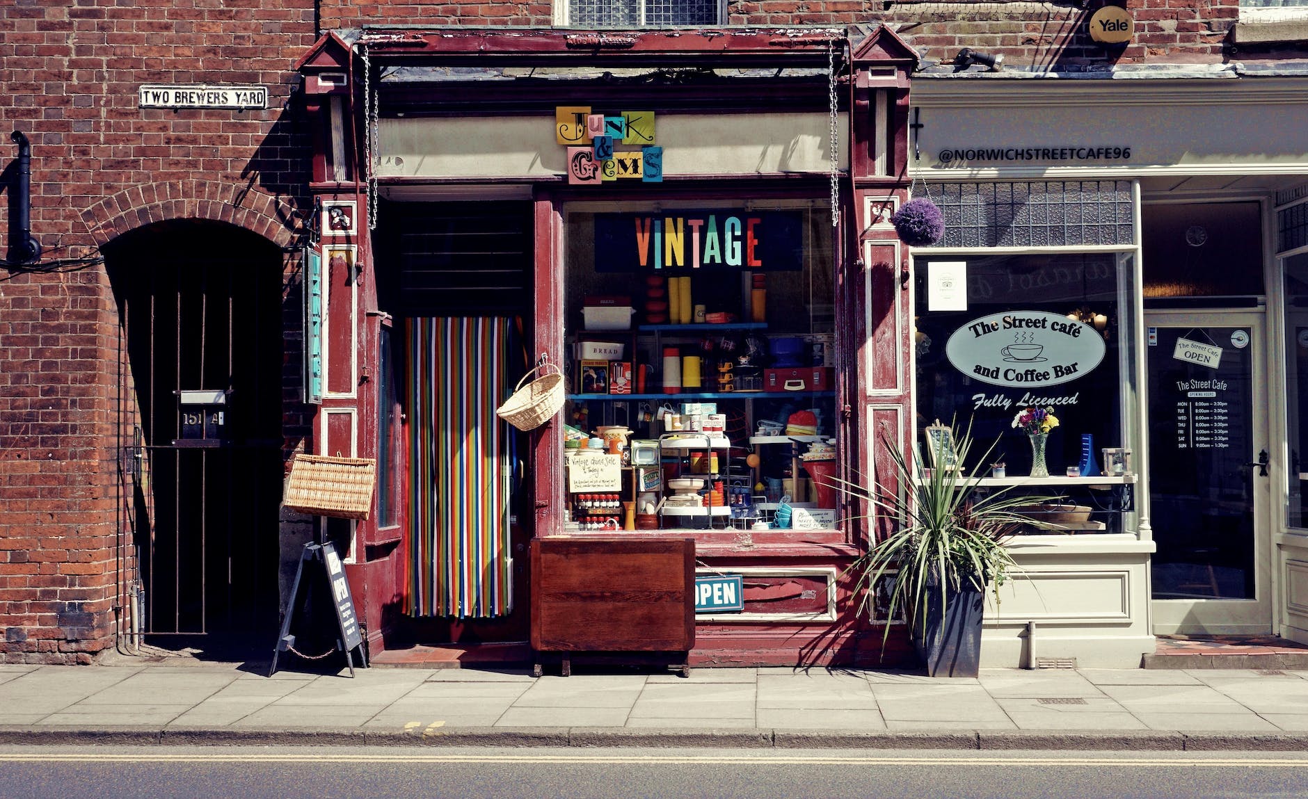 Vintage shop storefront filled with colourful items.